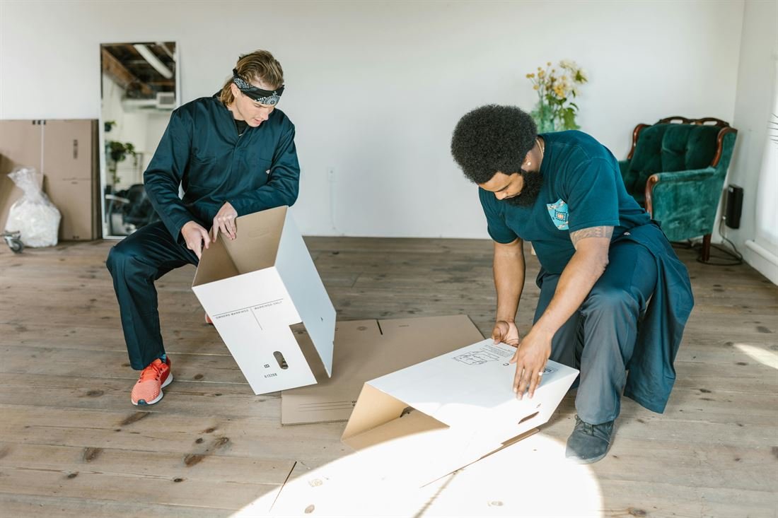 Express movers prepping boxes for a last-minute move